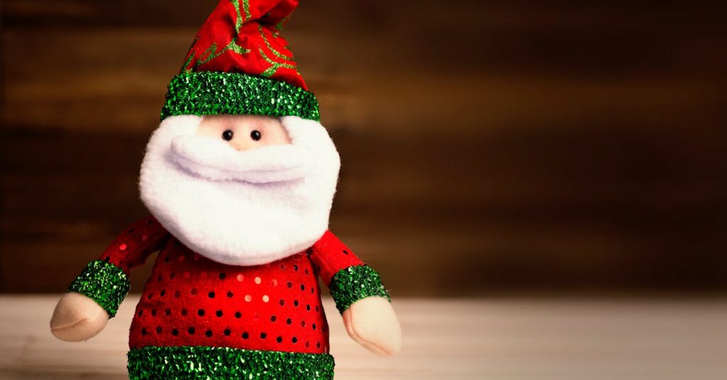 Cute Santa Claus plush toy wearing red and green attire sits on a wooden surface, perfect for holiday decor.
